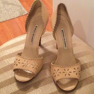 Manolo  Blahnik nude pumps.